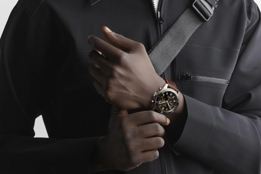 Black Longines Flyback watch on model's wrist