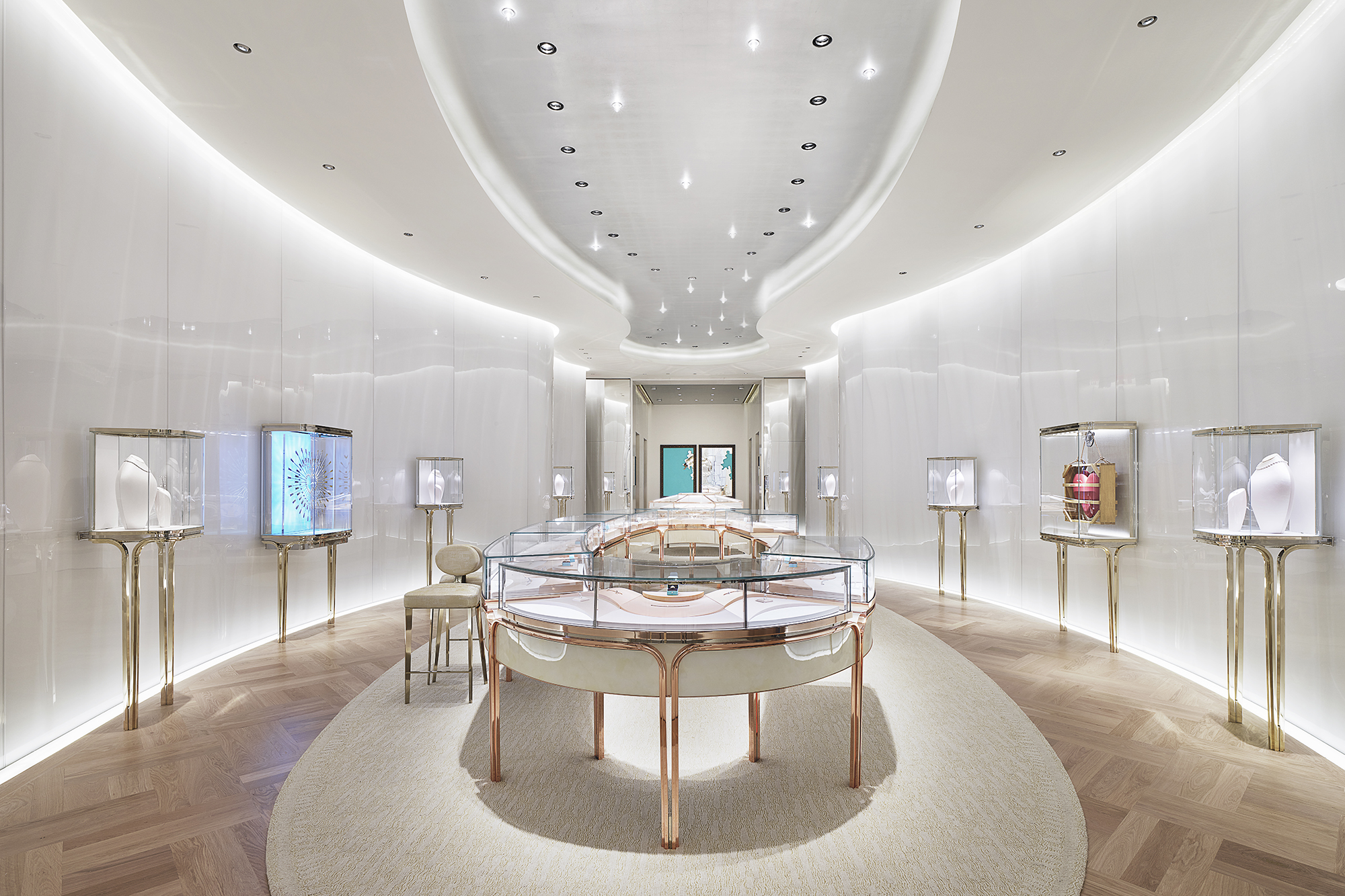 Tiffany & Co. The Landmark interior lit by white light with white table and display cases